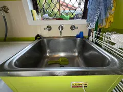 New quarter-turn wall taps above a laundry tub in Bonnet Bay