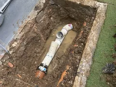 New sewer pipe and two reline junctions laid in an open trench in Caringbah
