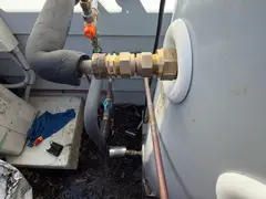 New brass fittings on the hot outlet of a heat pump in Caringbah South