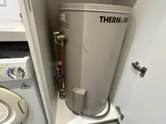 New electric hot water system in a laundry cupboard in Caringbah South