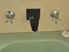 New bath taps fitted over a green bath in Jannali