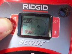 Pipe locator tracing a sewer line at a Loftus property