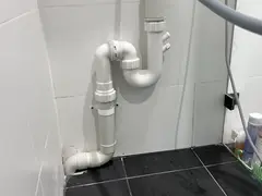 New trapped washing machine waste connection in a Miranda laundry