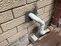 New PVC waste pipe through an outside wall in Oyster Bay