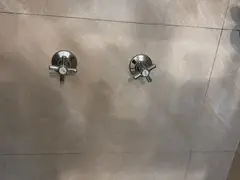 New wall taps fitted in a Woolooware bathroom